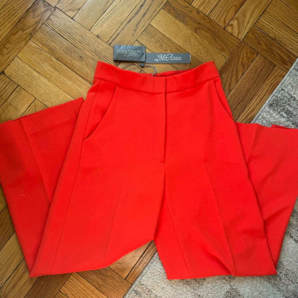 Leló Rose premium red wide-leg trousers. Vibrant vermilion color with sleek tail